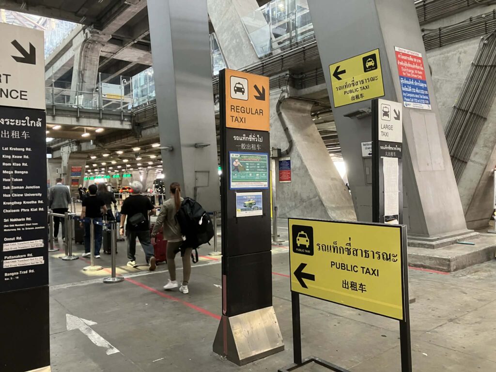 Public taxi signs and queue area on the 1st floor of Suvarnabhumi Airport