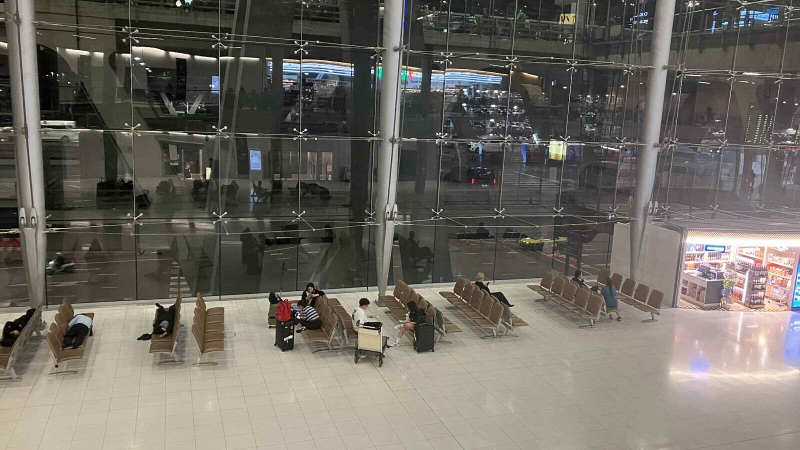 Passengers sleeping on benches at Suvarnabhumi Airport 2F arrivals hall overnight