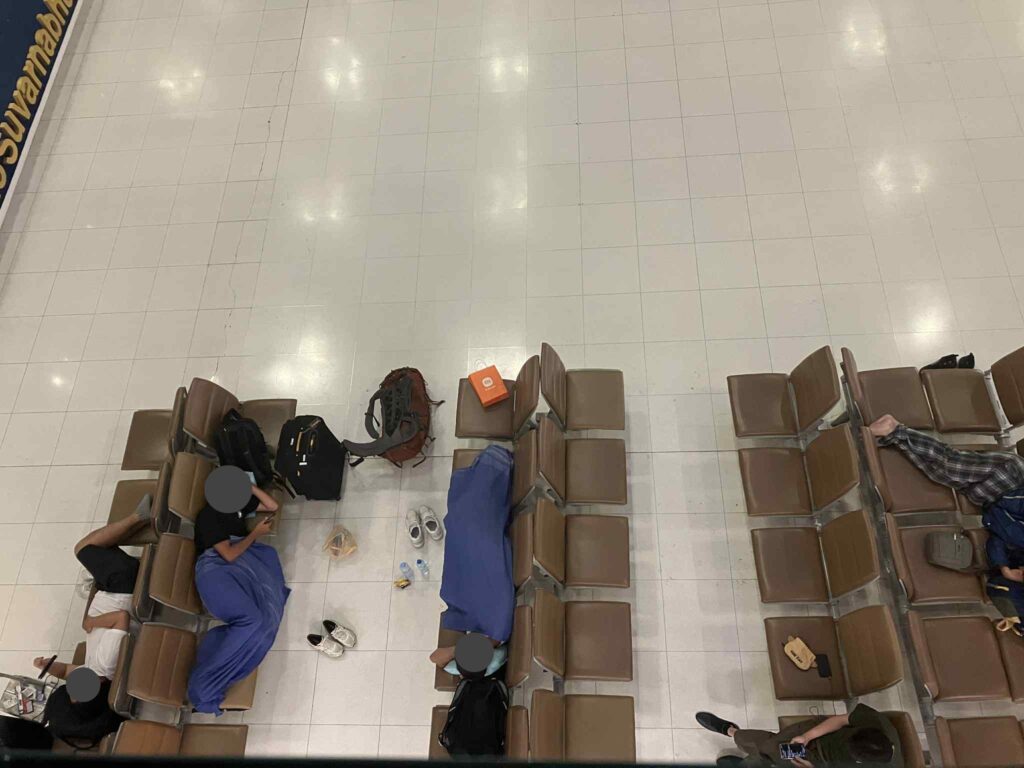 Passengers sleeping across benches at Suvarnabhumi Airport 2F arrivals hall overnight