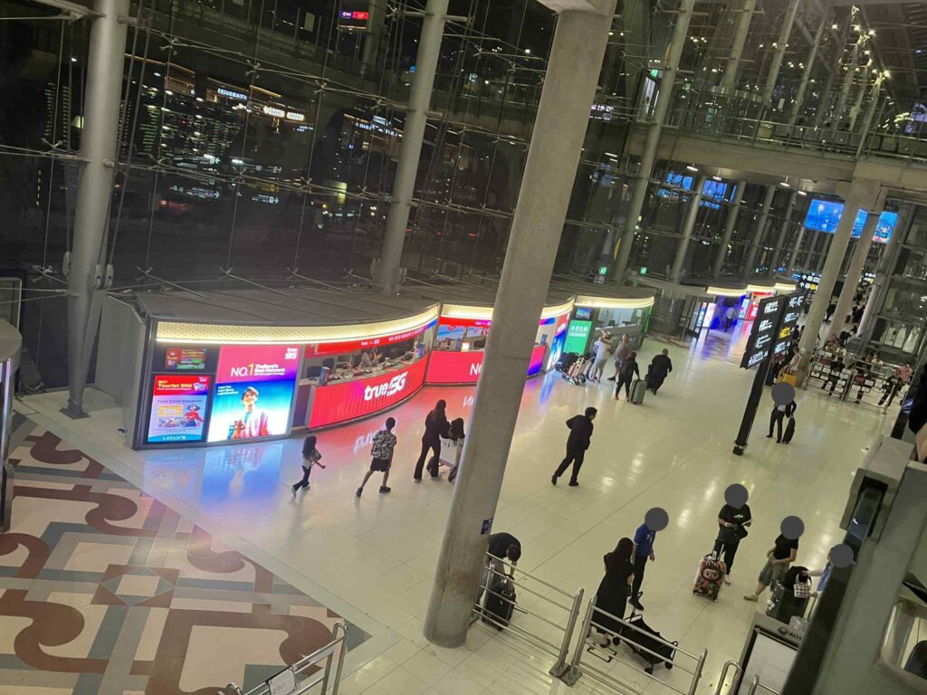 TrueMove and AIS SIM counters at Suvarnabhumi Airport 2F at night