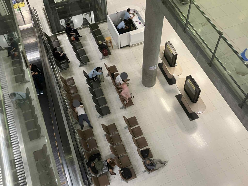Passengers sleeping on benches and floor at Suvarnabhumi Airport overnight