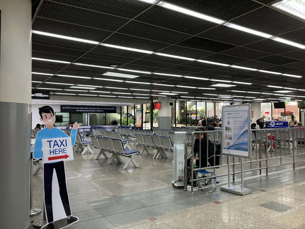 Taxi pickup sign inside Don Mueang Airport