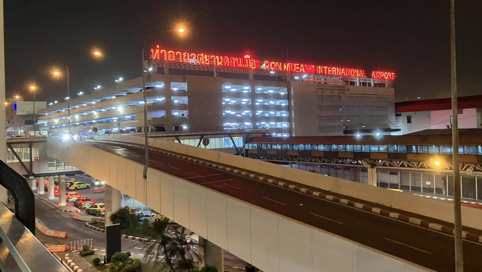 Don Mueang International Airport exterior at night in Bangkok
