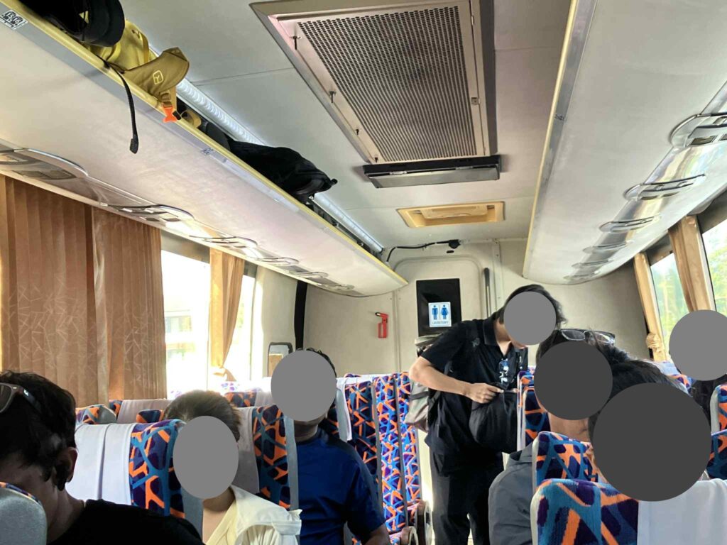 pattaya to suvarnabhumi airport bus interior seats luggage overhead