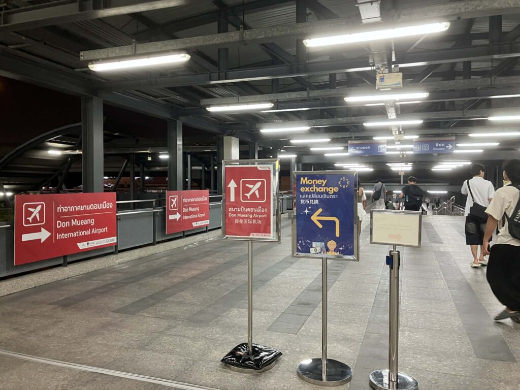 Direction sign to Don Mueang International Airport from the railway station