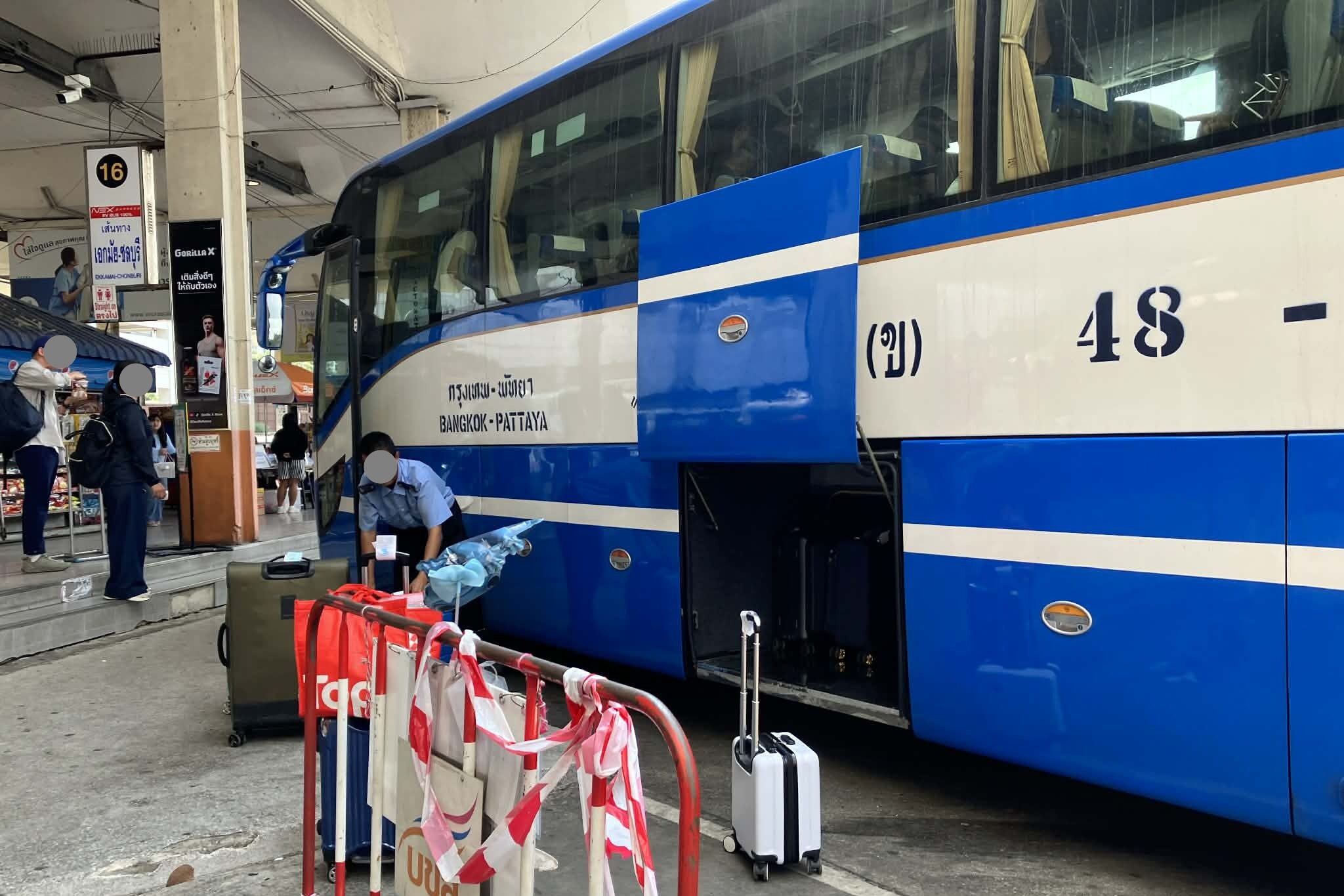 Luggage being loaded under the Ekkamai to Pattaya bus