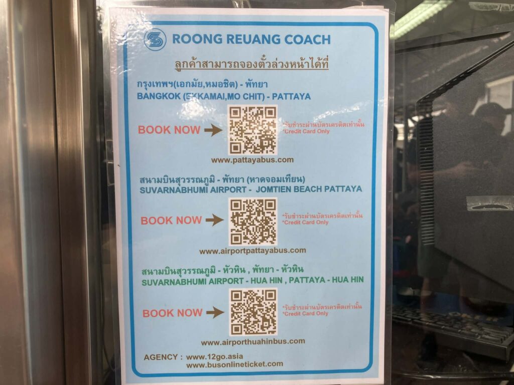 Roong Reuang Coach booking sign showing official websites and 12Go agency information