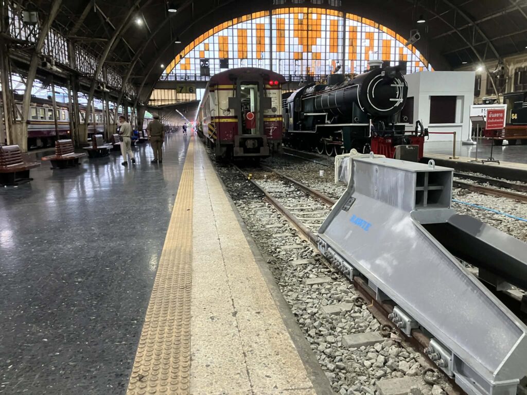 Local Thai train waiting at the platform inside Hua Lamphong Station