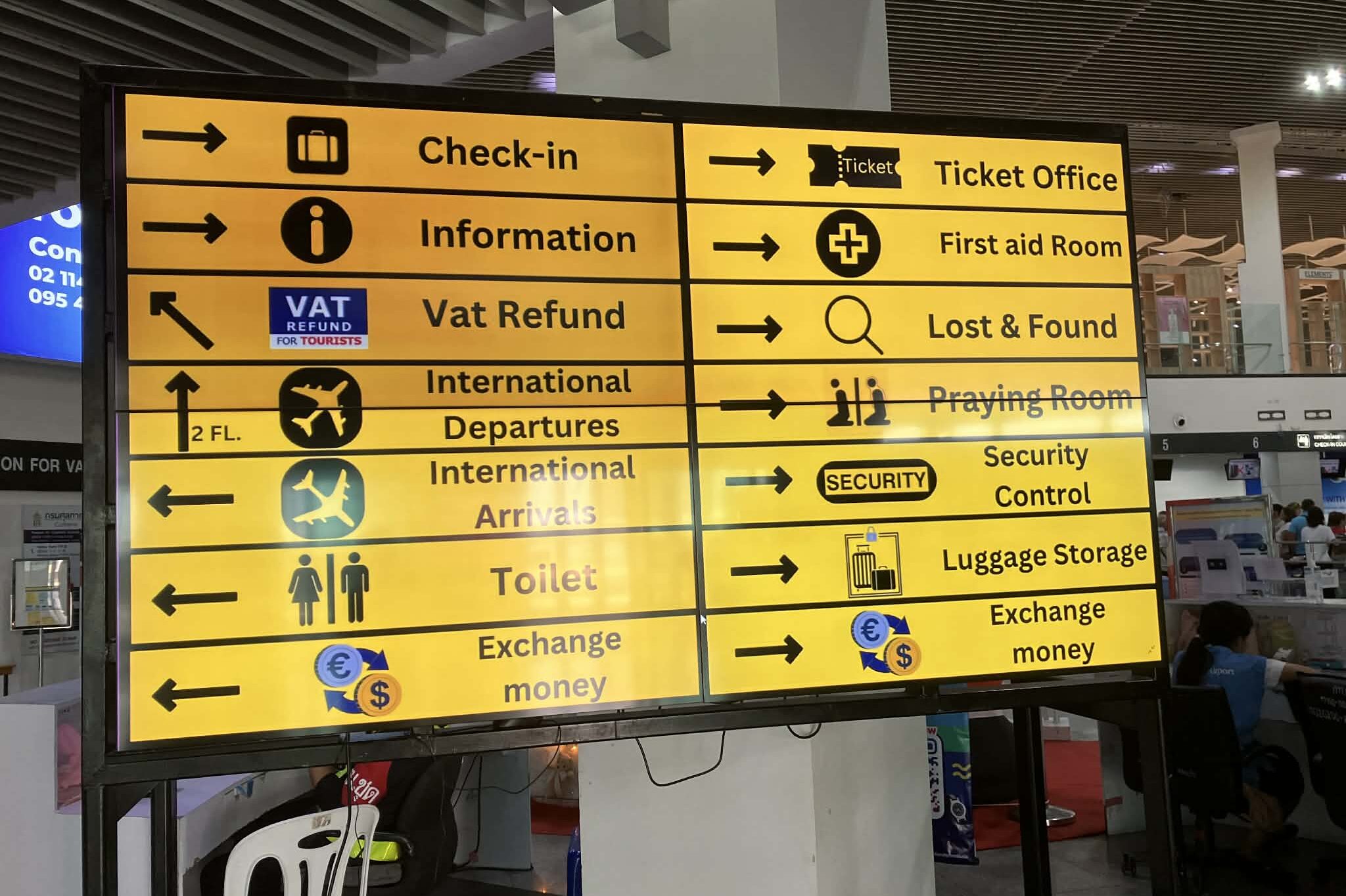 Direction sign inside U-Tapao Airport terminal