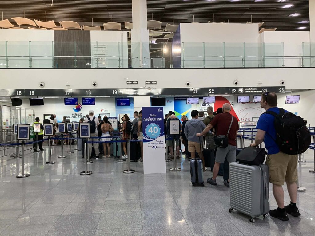 Passengers queuing at U-Tapao Airport domestic check-in counters