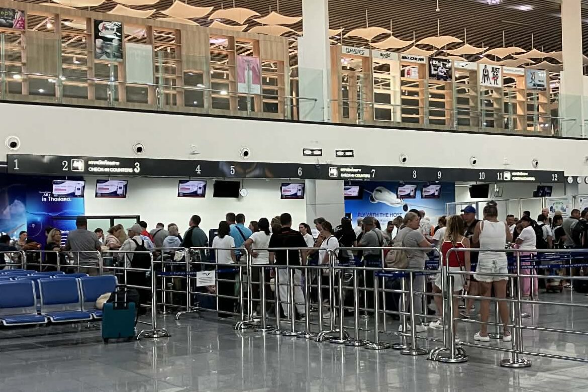 Passengers queuing at U-Tapao Airport check-in counters